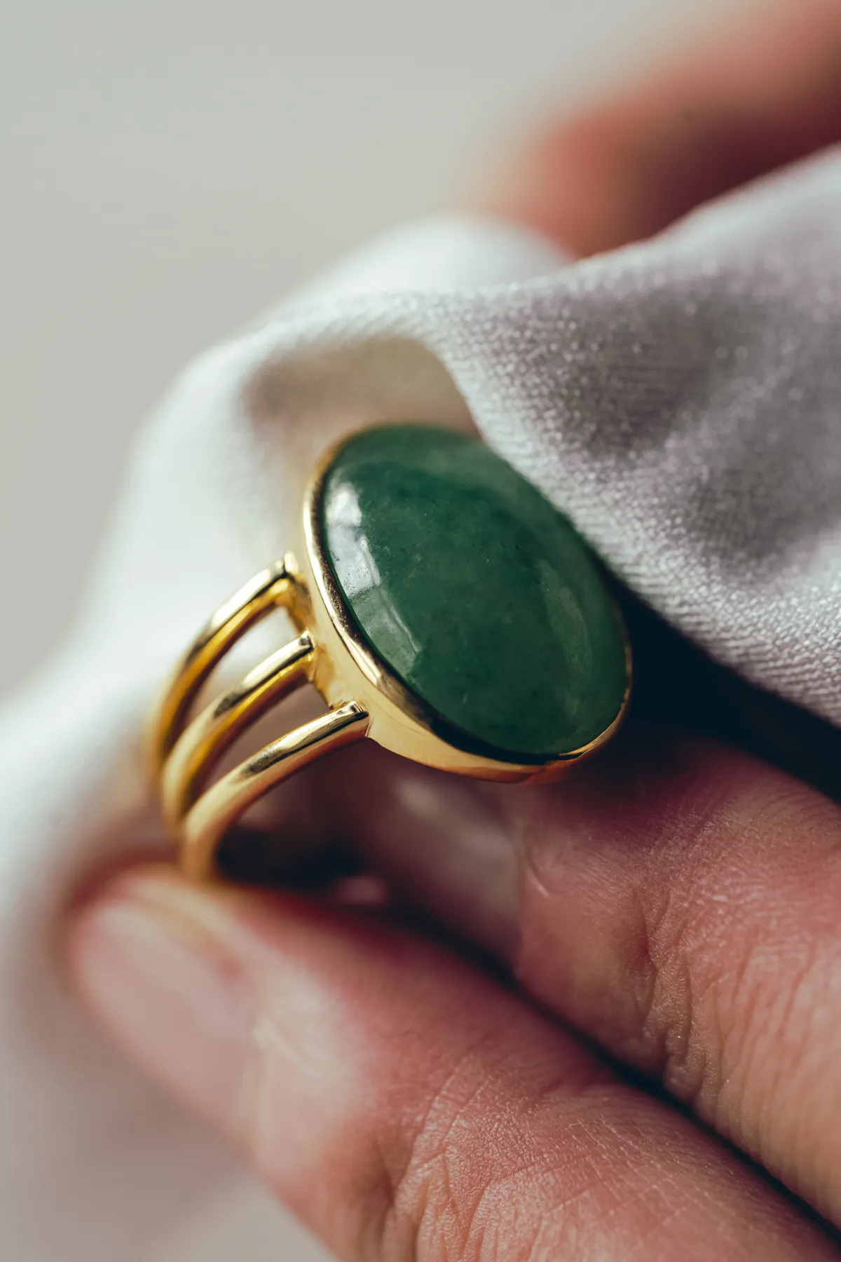 Wiping a jade ring with a soft cloth